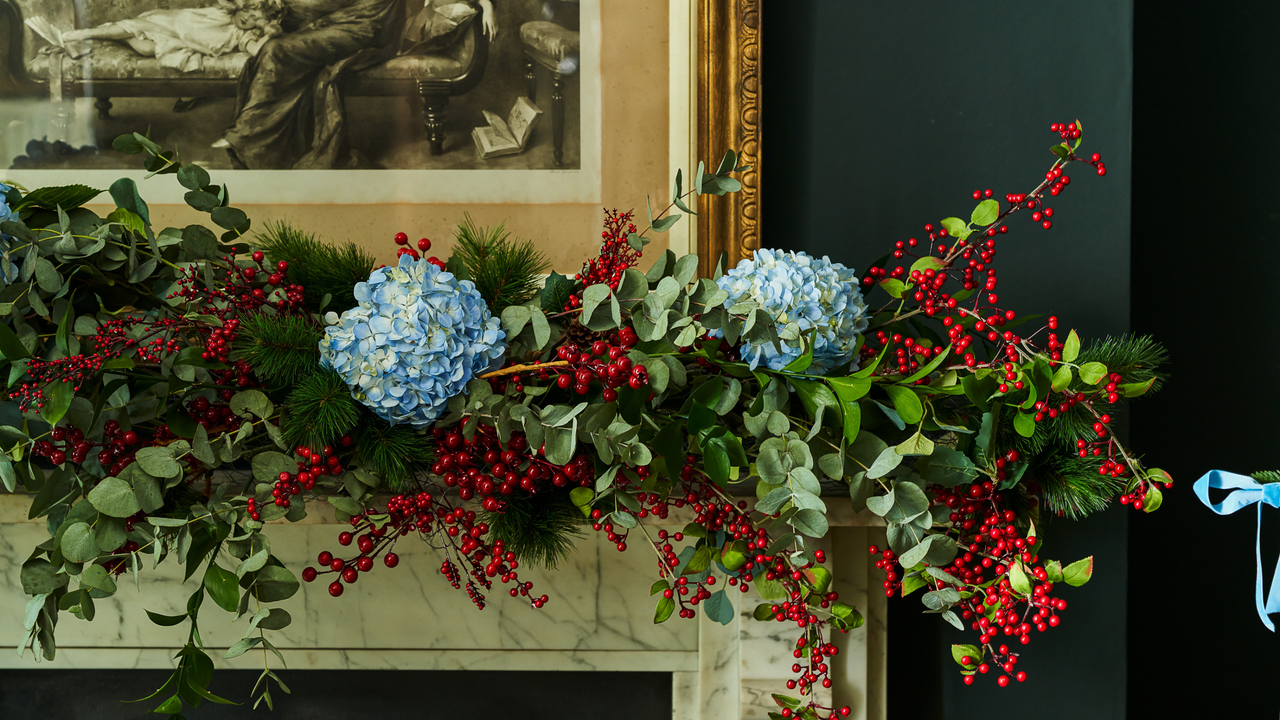 blue hydrangea flowers and red berries as part of a Christmas mantlescape