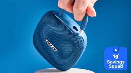 Tozo PE1 portable Bluetooth speaker with a savings squad badge on a ble background. 