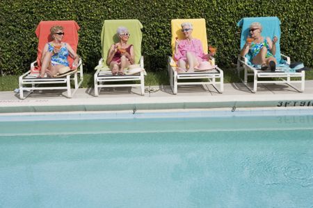 Senior Friends Poolside with Drinks