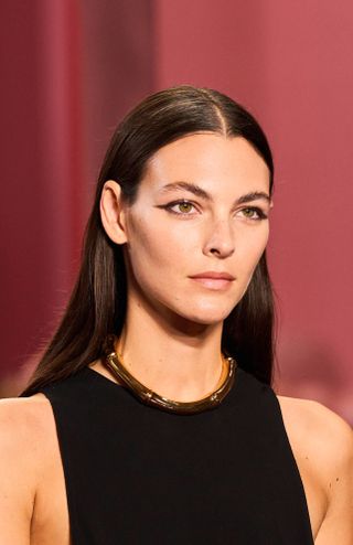 Model at Gucci S25 show wearing winged eyeliner