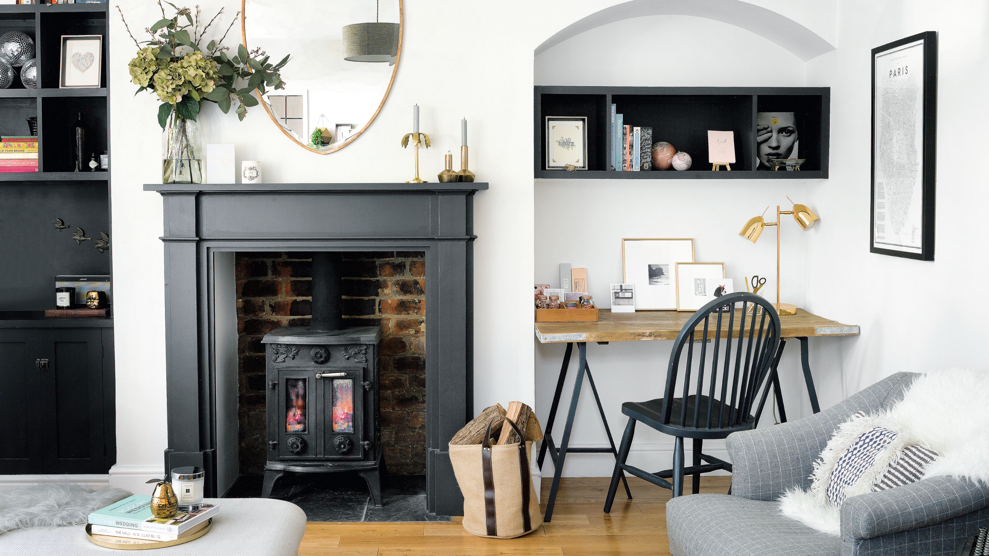 White living room with black fireplace and log burner in it