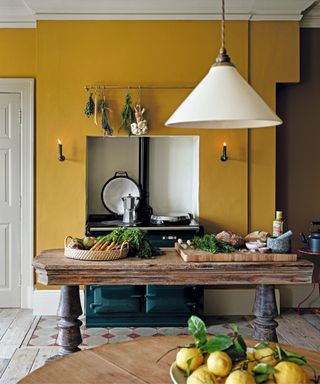 Yellow wall, white door and lamp, wooden table