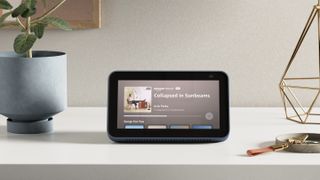 Amazon Echo Show 5 playing music on a desk