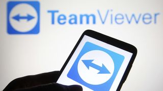 TeamViewer logo on mobile phone screen with TeamViewer written above it