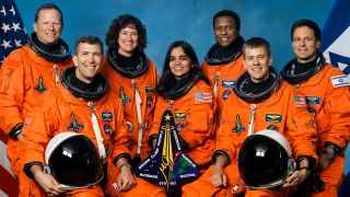 The Columbia crew, Kalpana Chawla, Rick Husband, Laurel Clark, Ilan Ramon, David Brown, William McCool and Michael Anderson, pose in their spacesuits. 