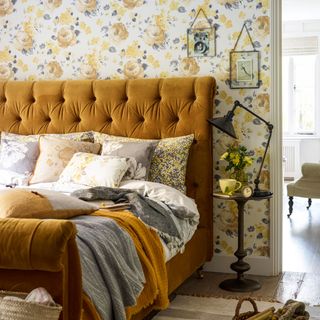 bedroom with floral wallpaper and golden colour bed