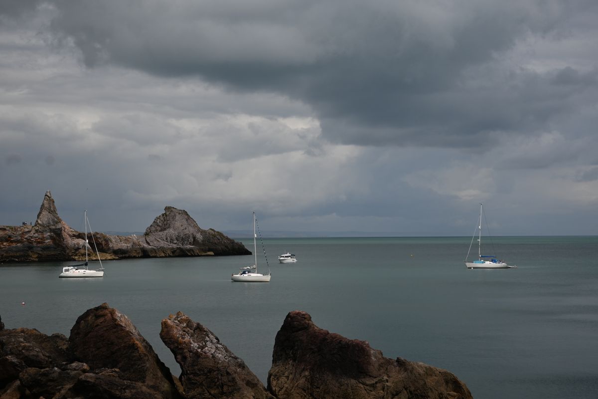 Some boats sailing in a bay