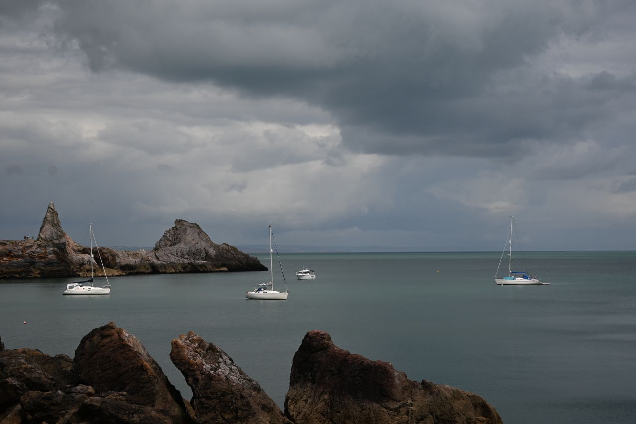 Some boats sailing in a bay