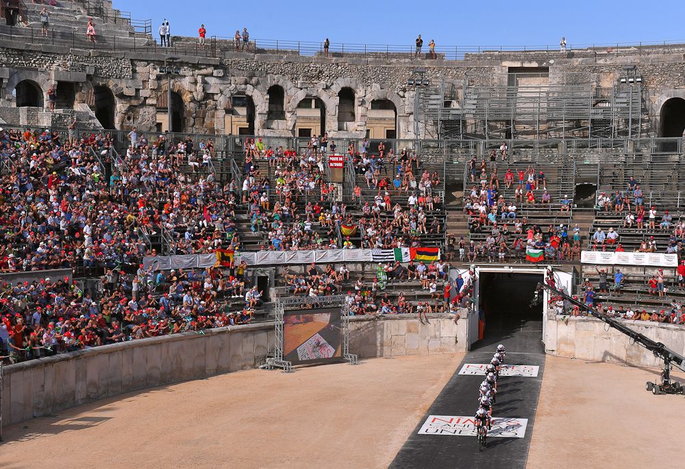 Riders leave the Nimes arena during stage 1 at the Vuelta