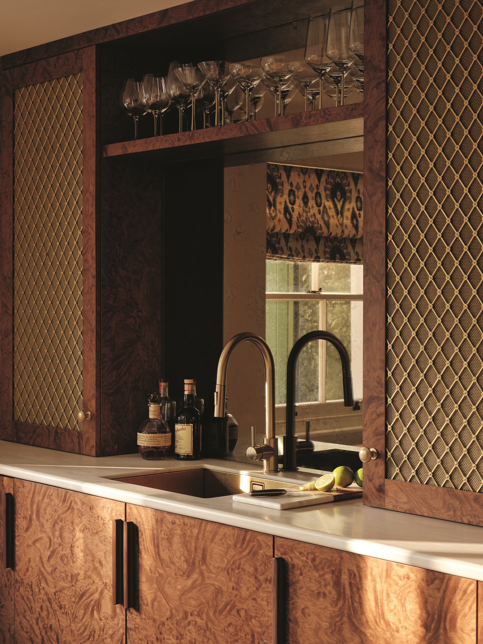 a home bar with a veneer door, and metal cabinetry