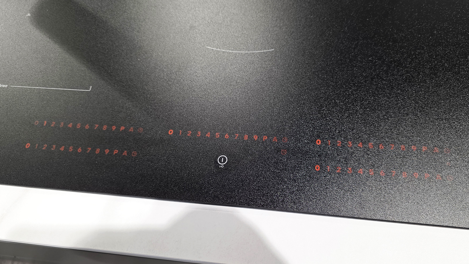 A black induction cooktop from Hisense on a kitchen countertop