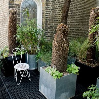 Garden with rubber tiles and chair