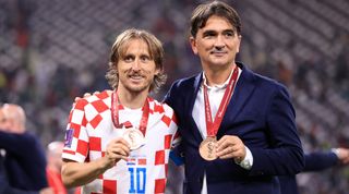 Luka Modric of Croatia and Croatia manager Zlatko Dalic pose with their bronze medals after the FIFA World Cup Qatar 2022 3rd Place match between Croatia and Morocco at Khalifa International Stadium on December 17, 2022 in Doha, Qatar.