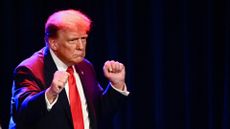 ormer US President and 2024 presidential hopeful Donald Trump gestures during a Caucus Night watch party in Las Vegas, Nevada