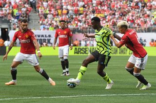 Eddie Nketiah of Arsenal FC battles against Lisandro Martínez of Manchester United during the first half in the pre-season friendly between Arsenal FC and Manchester United at MetLife Stadium on July 22, 2023 in East Rutherford, New Jersey.