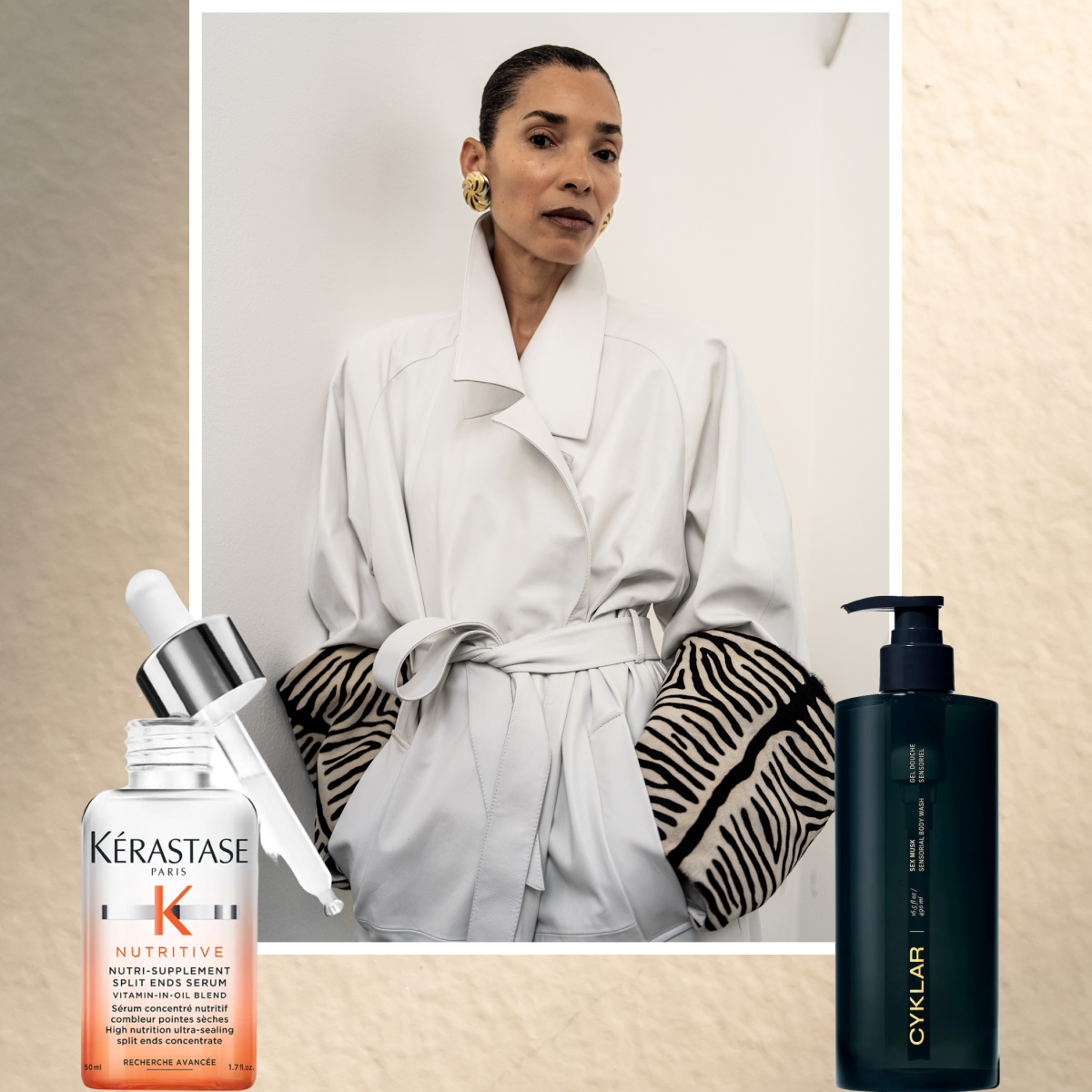 A woman wearing a white trench coat with zebra print cuffed sleeves, and she is positioned above two beauty products