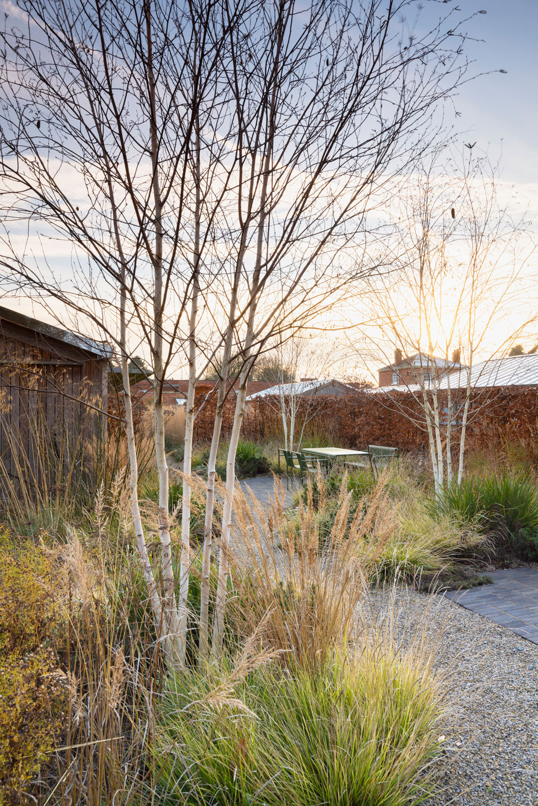 walled garden in winter with grasses and gravel