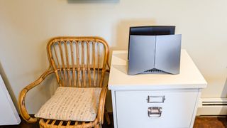 TP-Link Archer GE800 on desk in living room