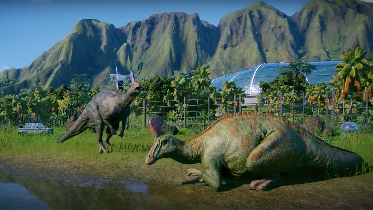 Des herbivores qui se reposent dans leur hutte dans Jurassic World : Evolution 2.