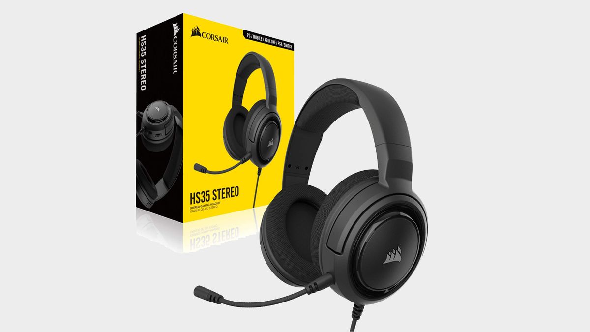 Image of a black headset and its box sitting behind it.