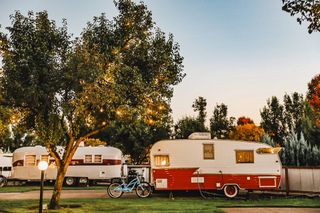 Two vintage Airstream trailers with bikes next to them at The Vintages Trailer Resort in Dayton, Oregon