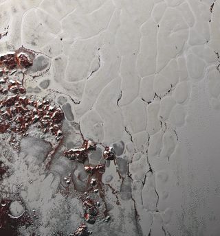 The icy Pluto plain known as Sputnik Planitia — seen here in a photo taken by NASA’s New Horizons probe during its flyby of the dwarf planet in July 2015 — is covered with ice “cells” that are geologically young and turning over due to convection.