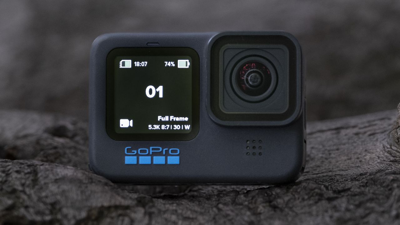 The GoPro Hero 11 Black action camera sitting on a wooden platform