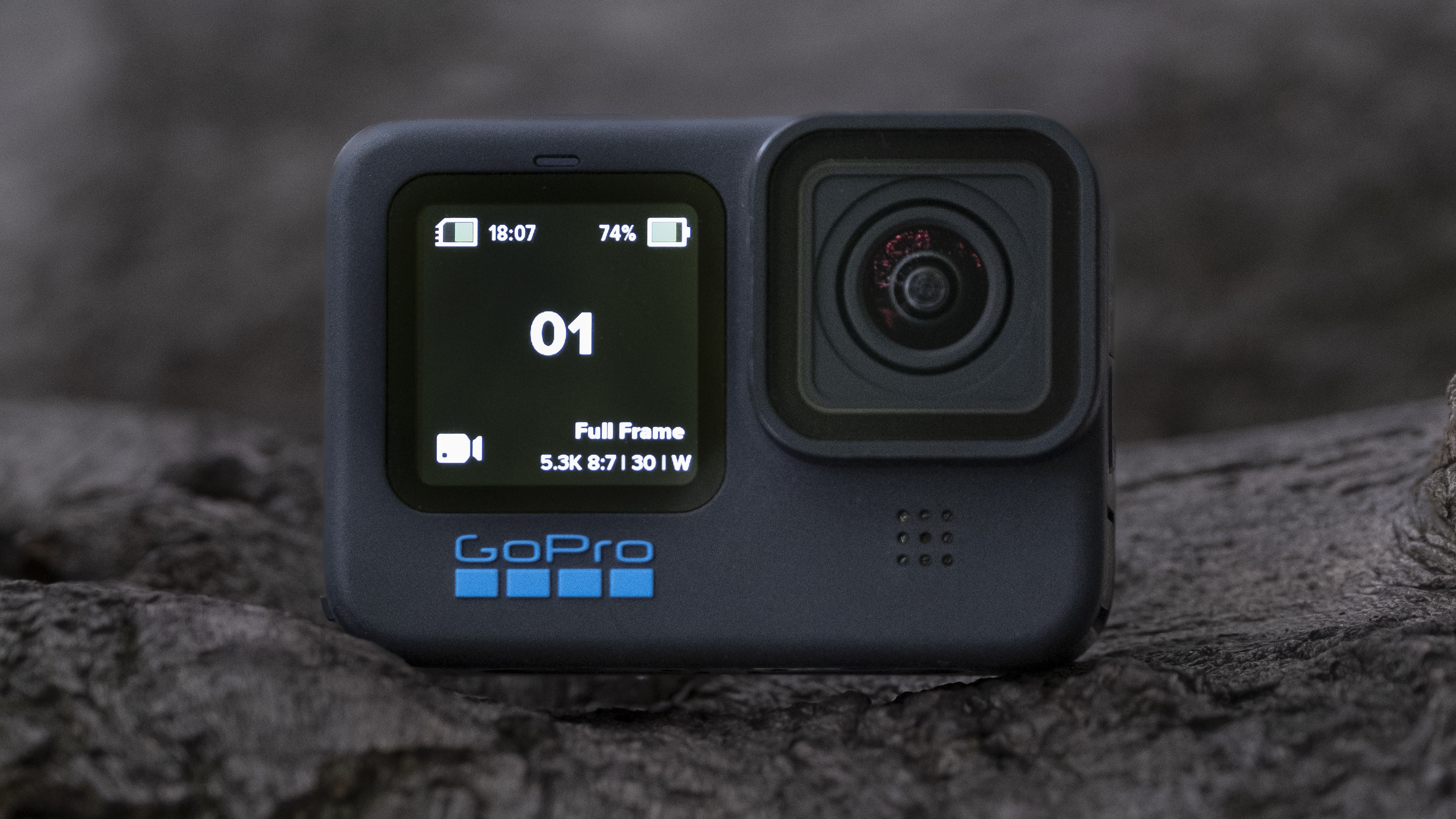 The GoPro Hero 11 Black action camera sitting on a wooden platform