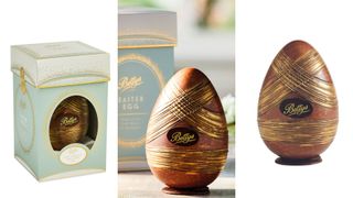 Chocolate egg with gold details and a pastel blue box in the background