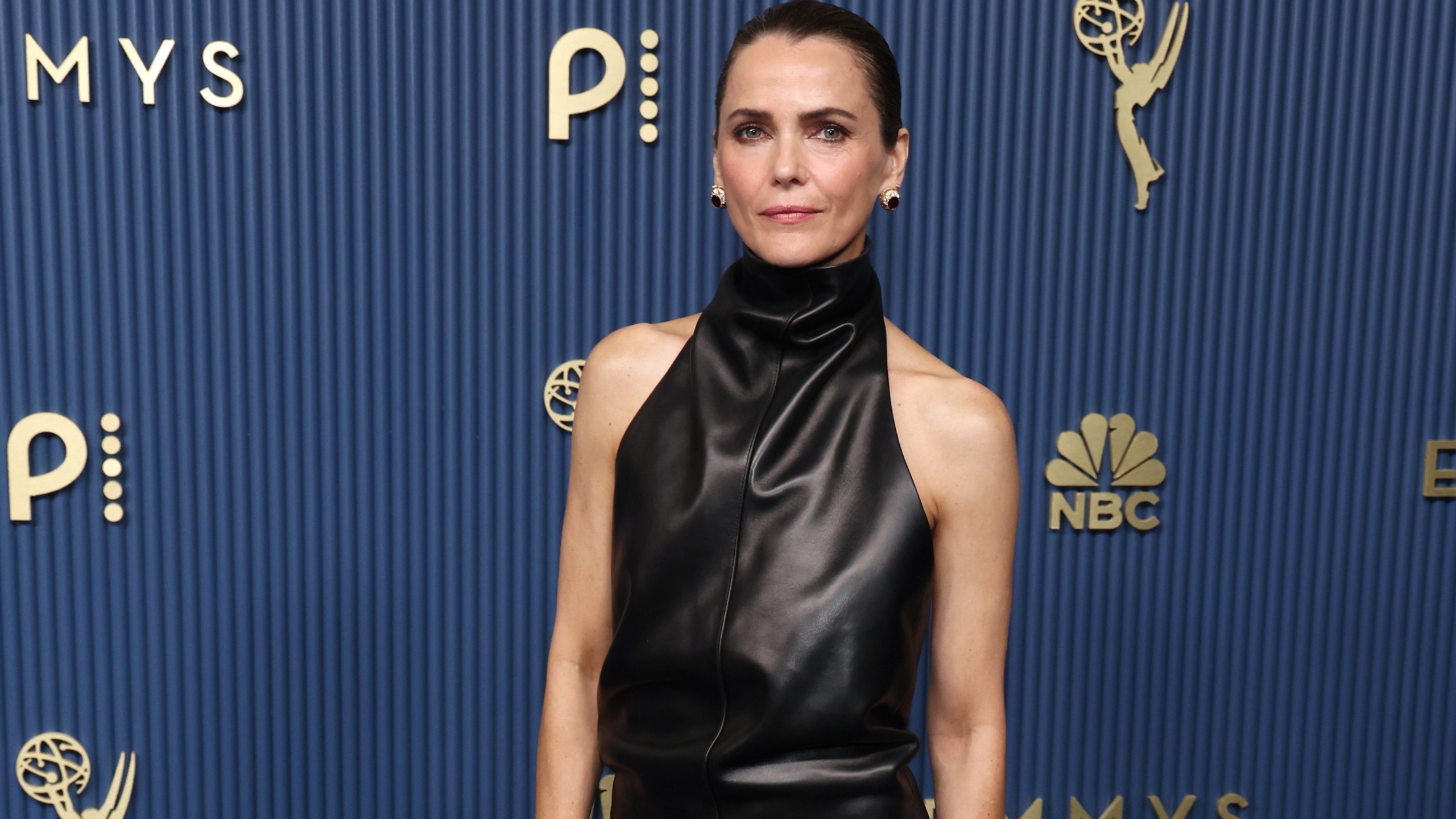 keri russell wears custom khaite dress to 2026 emmys red carpet. black leather