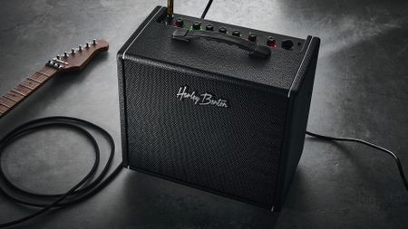 Harley Benton DNAFX AmP20: the compact 1/8" modelling combo is finished in black and photographed in close-up and against a slate floor