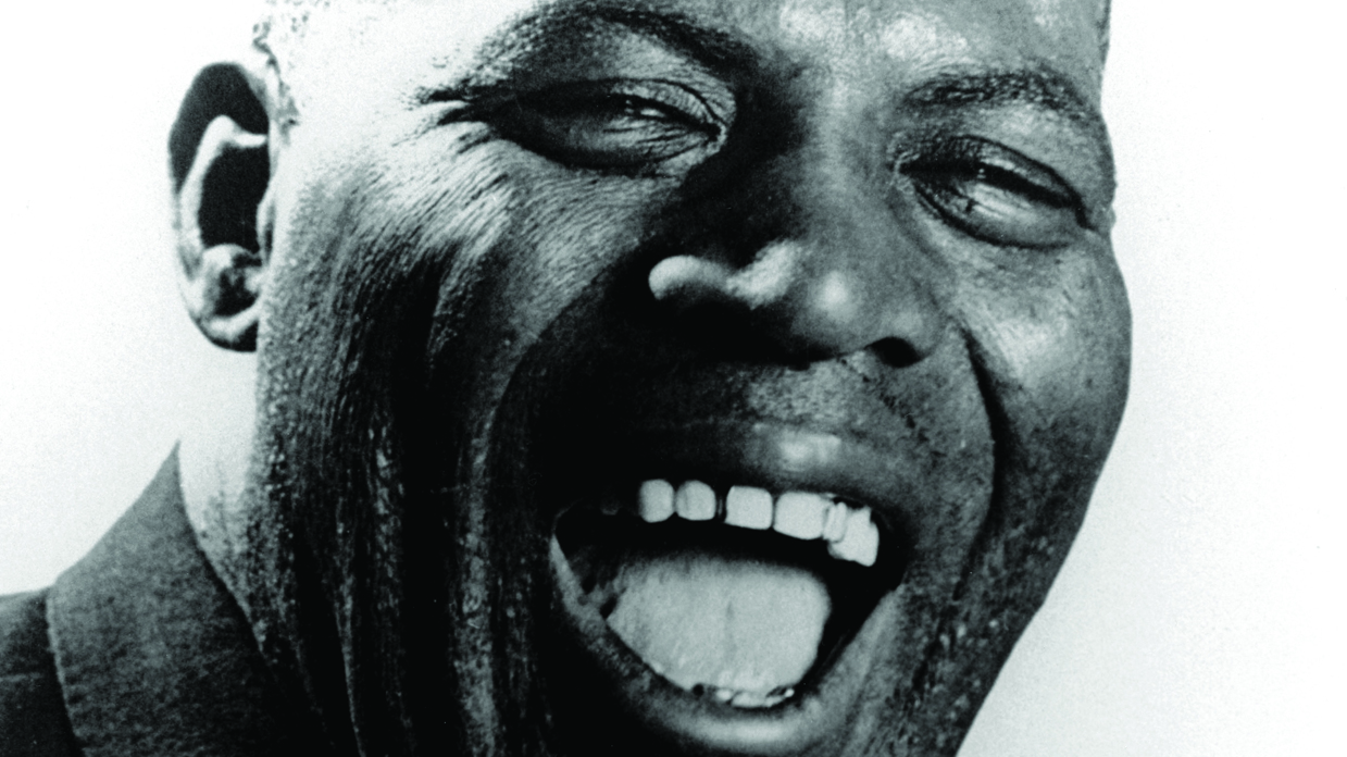 Howlin&#039; Wolf smiling with his mouth open.