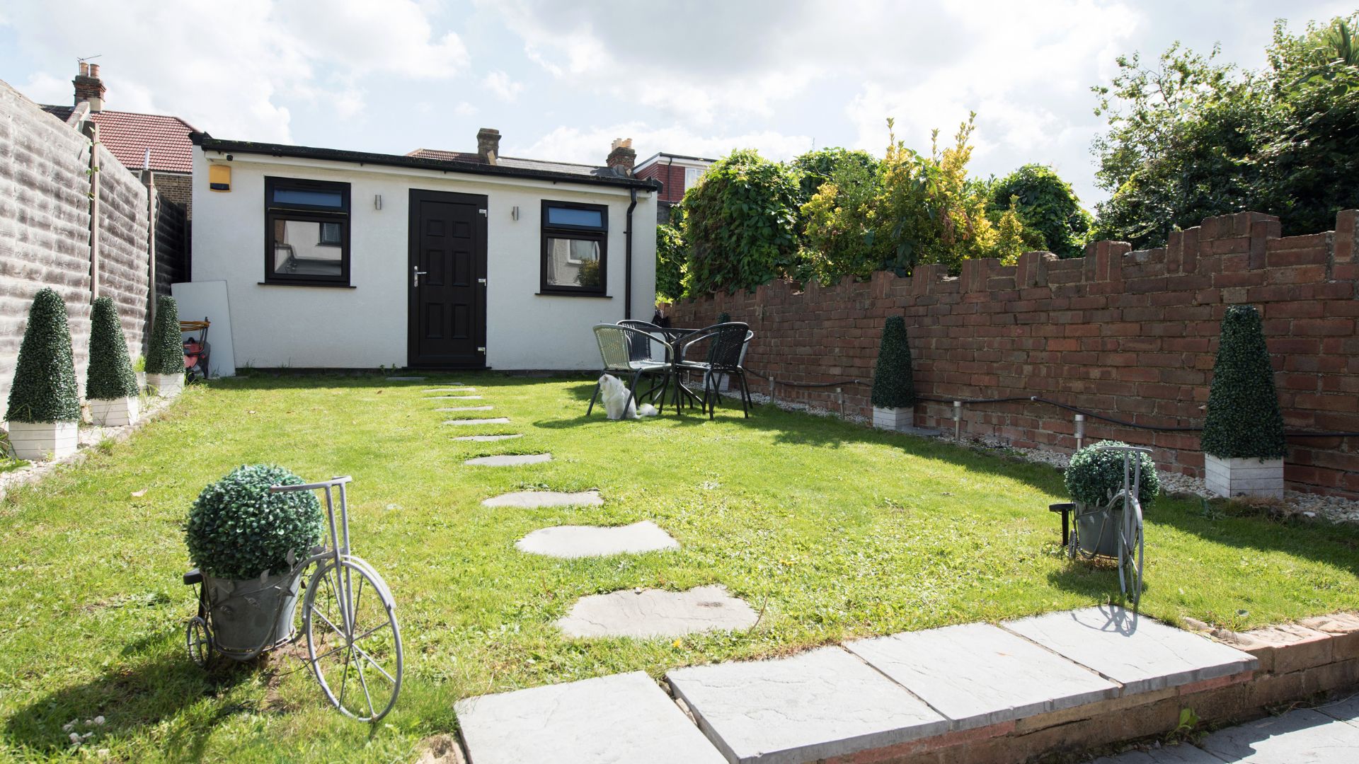 picture of large converted shed ouhouse in back garden