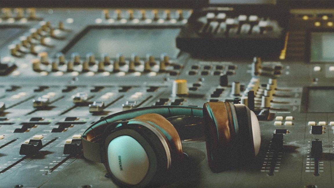 Adobe Firefly explained; a studio render with headphones