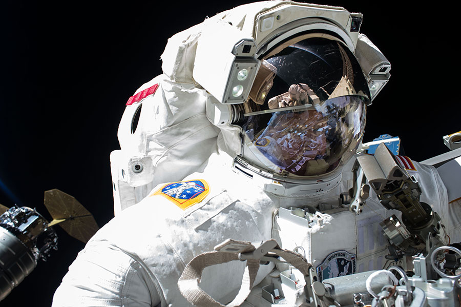 NASA astronaut Peggy Whitson is pictured with an Orbital ATK Cygnus spacecraft (left) during a May 12, 2017 spacewalk outside the International Space Station. Whitson, the station&#039;s commander, and fellow NASA astronaut Jack Fischer will conduct a repair s