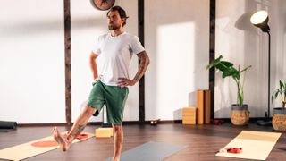 a man standing on one leg