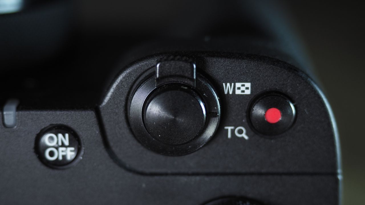 Canon PowerShot V1 on a wooden surface
