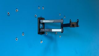 Perlesmith PSSFK1 TV wall mount arm on blue wall