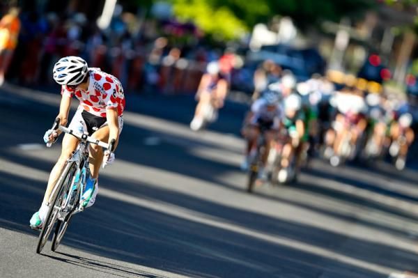 The leader of the KOM jersey breaks from the field