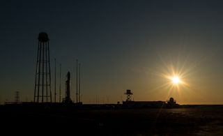  Orbital Sciences Corp.'s first Antares rocket is seen during sunrise on the Mid-Atlantic Regional Spaceport (MARS) Pad-0A at the NASA Wallops Flight Facility in Virginia, Sunday, April 21, 2013.