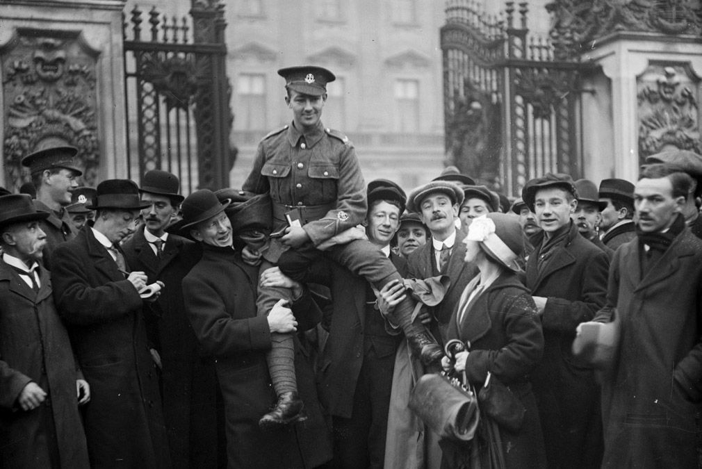 29th November 1916:Private Ryden, VC is lifted aloft on the shoulders of his friends after being invested with the Victoria Cross at Buckingham Palace, London.(Photo by Topical Press Agency/G