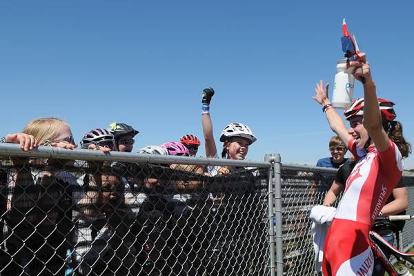 Lea Davison (Specialized) excitedly greets the Little Bellas at the short track finish