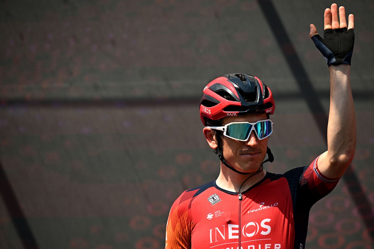 Geraint Thomas waves on stage