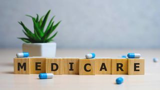 An image showing the word Medicare spelled out of wooden blocks