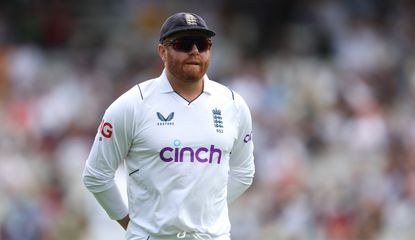 Bairstow looks on with sunglasses and England kit on