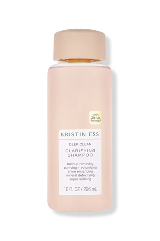 A bottle of Kristin Ess Deep Clean Clarifying Shampoo set against a white background.