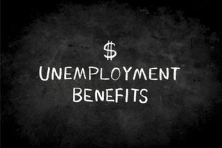 the words unemployment benefits written on a black chalkboard with a dollar sign above