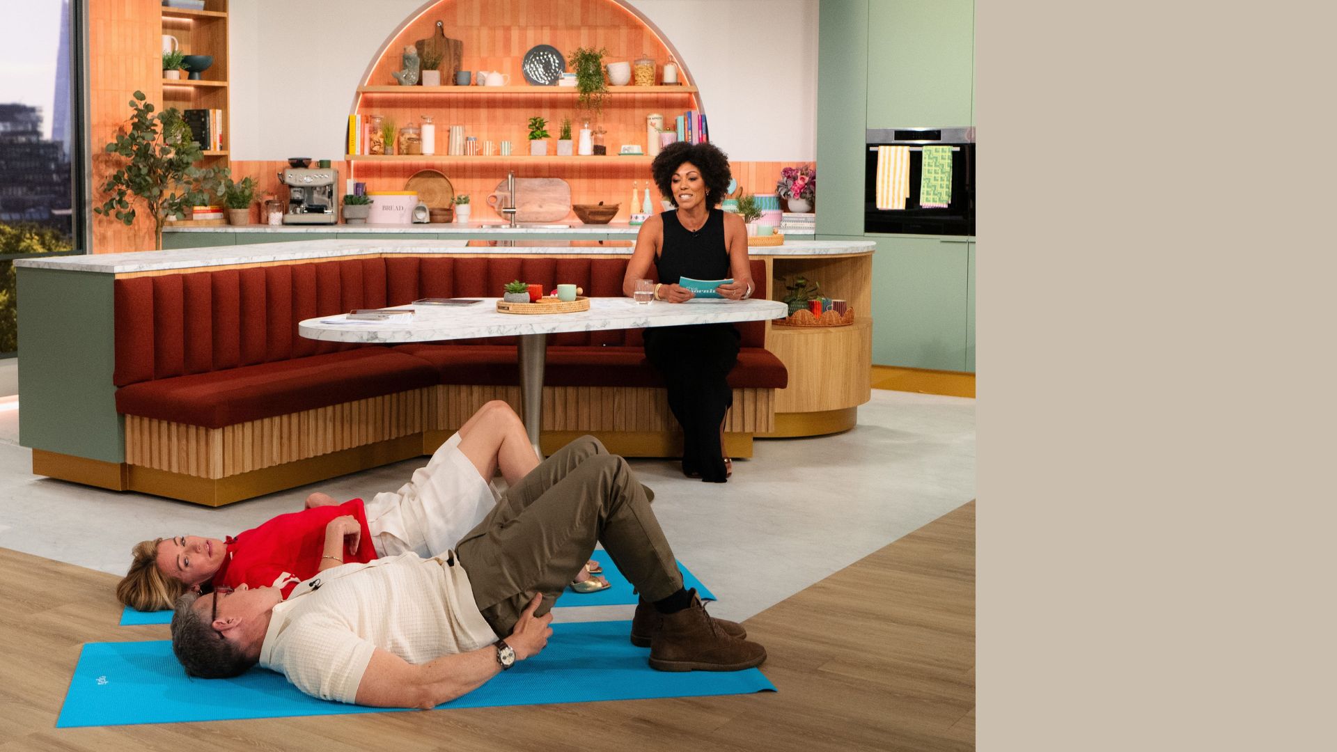 Dr Zoe Williams instructing Ben and Cat how to do lying down exercises on ITV