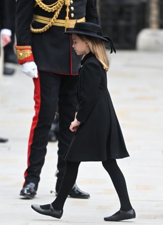 Britain's Catherine, Princess of Wales, Princess Charlotte and Prince George arrive for the State Funeral Service of Britain's Queen Elizabeth II at Westminster Abbey in London on September 19, 2022.