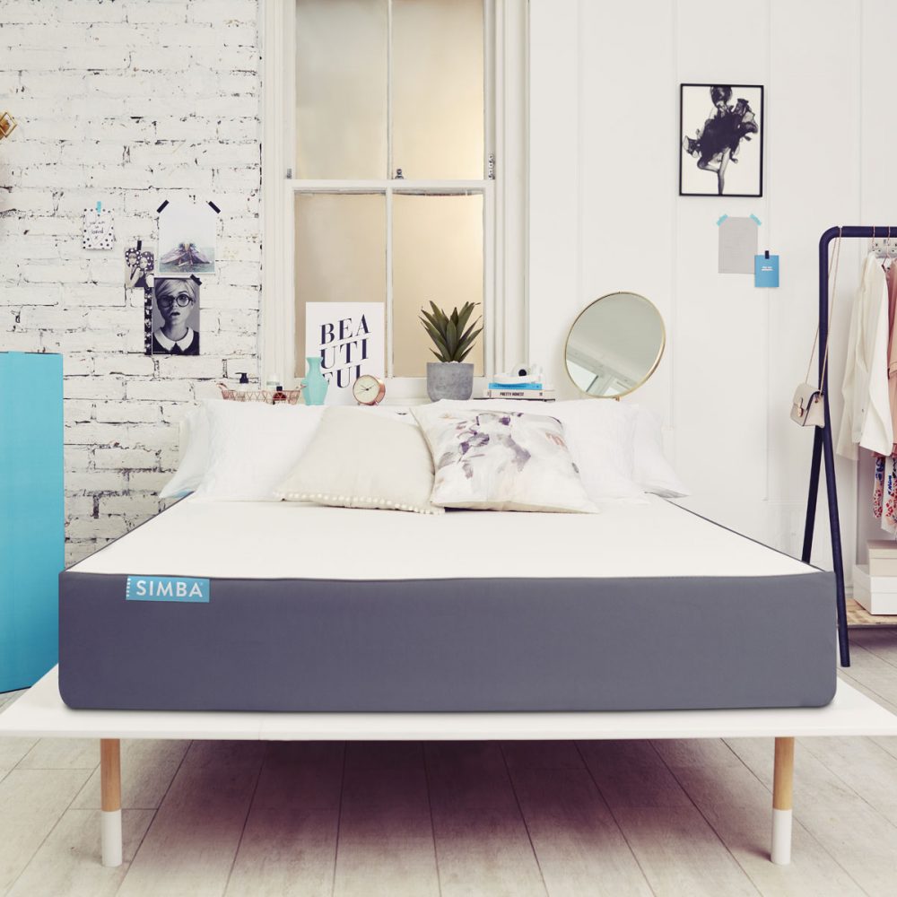 bedroom with wooden flooring and white wall